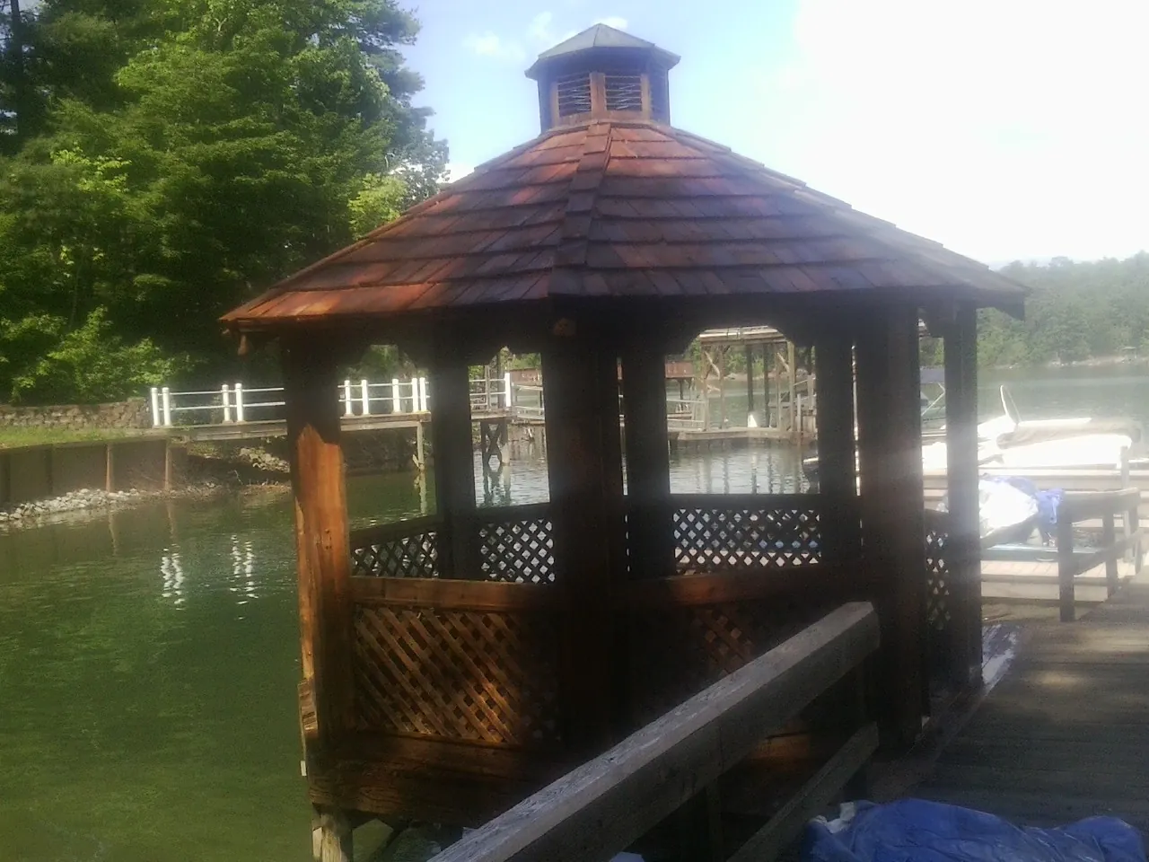 Cedar shake gazebo roof rebuilt on a lake dock in Somerville